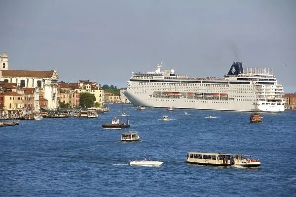 Europe, Italy, Venice. Large cruise ship (The Armonia) sailing on the narrow canals of Venice