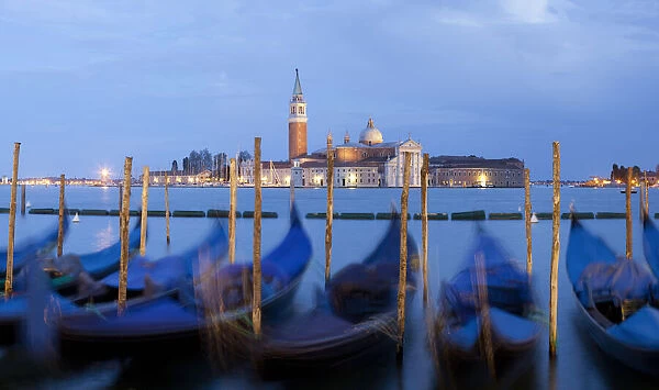 Europe, Italy, Venice. Sunset on gondolas and Church of San Giorgio Maggiore