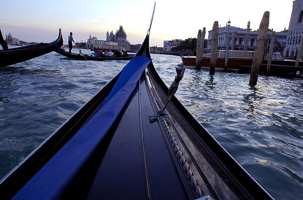 Europe, Italy, Venice. Typical sunset gondola ride through the canals of Venice