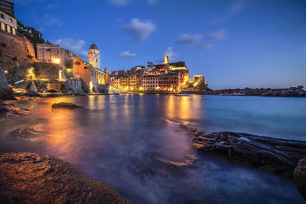 Europe, Italy, Vernazza. Landscape with village and ocean at sunset