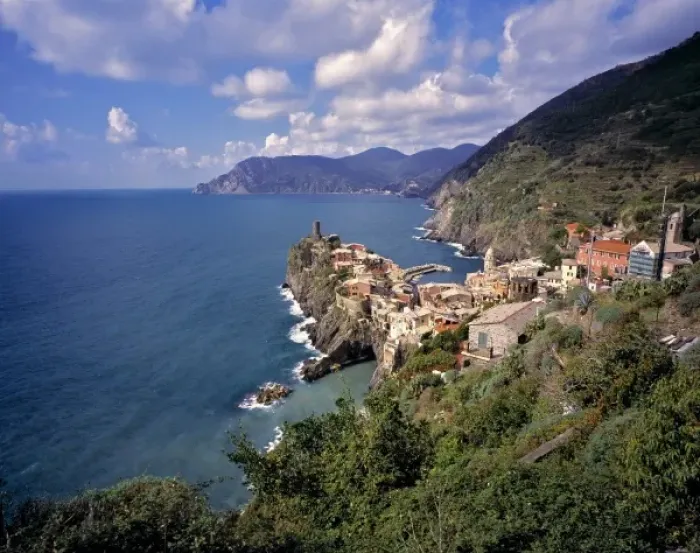 Framed Print : Europe, Italy, Vernazza. Red-tiled buildings look over the azure waters of the Mediterranean