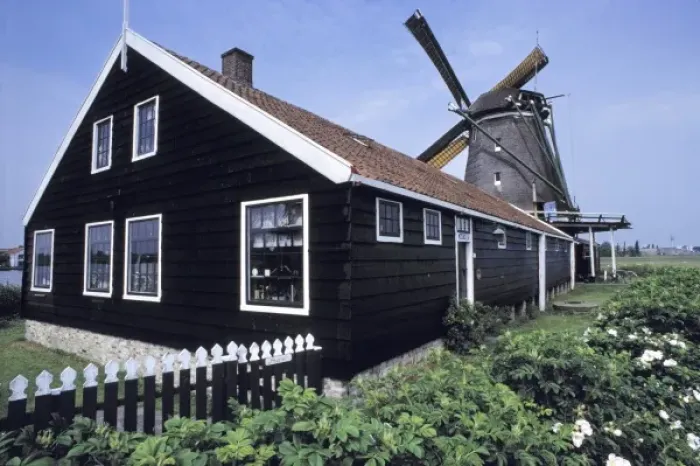 Framed Print : Europe, Netherlands, Amsterdam. A neat millhouse accompanies a willmill in the Amsterdam Framed Print : Europe, Netherlands, Amsterdam. A neat millhouse accompanies a willmill in the Amsterdam
