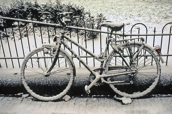 Europe, The Netherlands, Amsterdam. A snow-covered bicycle in Amsterdam in winter