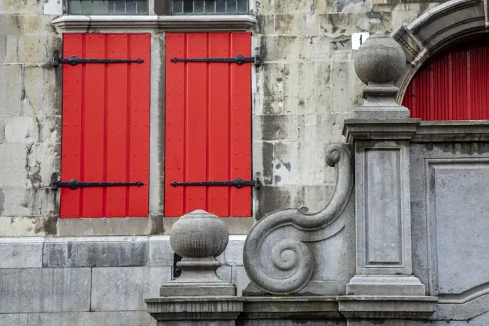 Framed Print : Europe, Netherlands, The Hague. Red shuttered window and stone scroll on 16th century Old