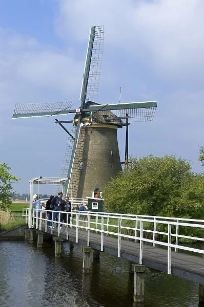 Europe, Netherlands, Holland, Kinderdijk, American tourist visit a windmill open