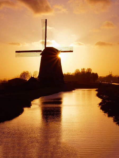 Europe; Netherlands; Nord Holland; Windmill along canal of Nord Holland