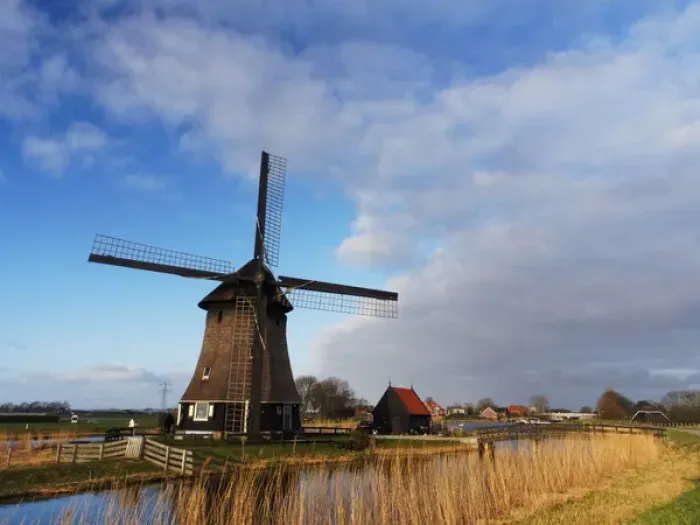 Framed Print : Europe; Netherlands; Nord Holland; Windmill along canal of Nord Holland
