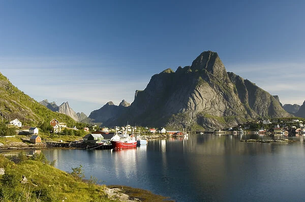 Europe, Norway, Lofoten. The community of Reine below the glacially sculped peak