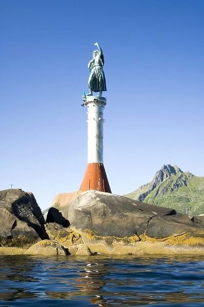 Europe, Norway, Lofoten, Svolvaer. The statue Fishermans Wife at the harbour entrance