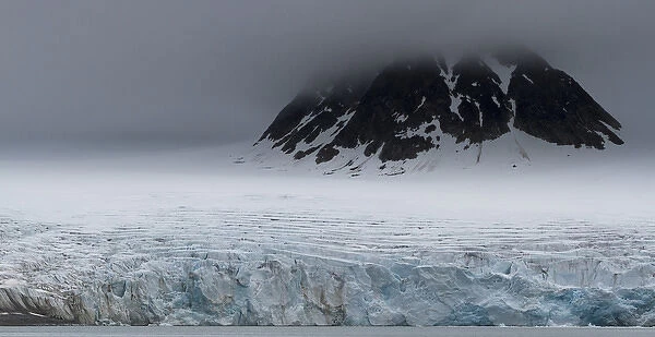 Europe, Norway, Spitsbergen, Svalbard. Glacier surrounds mountain