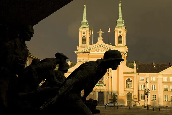 Europe, Poland, Warsaw. World War II memorial silhouette of statues