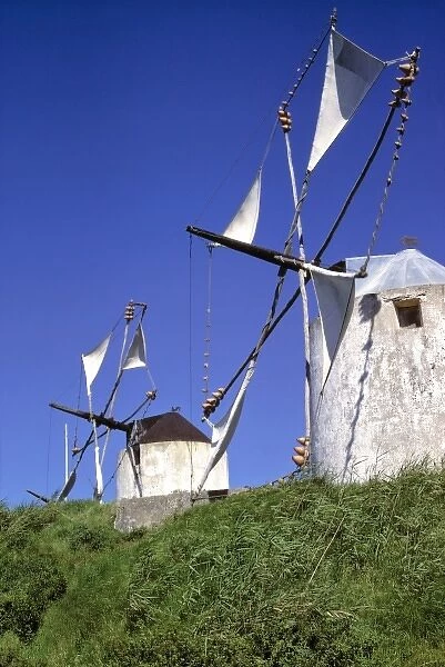 Europe, Portugal, Leiria. Windmill sails glides quietly in the breeze in the Leiria