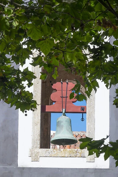 Europe, Portugal, Obidos. Patina-aged, oxidized copper church bell