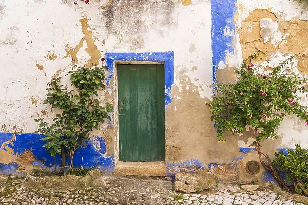 Europe, Portugal, Obidos. Weathered house exterior