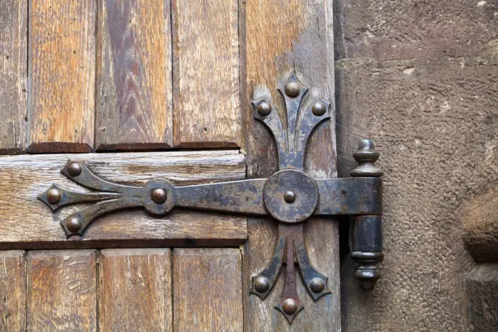 Framed Print : Europe, Romania. Brasov. Detail of church exterior. Wood Door hinge Framed Print : Europe, Romania. Brasov. Detail of church exterior. Wood Door hinge
