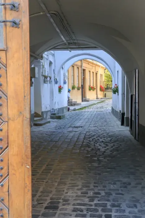 Framed Print : Europe, Romania, Brasov, cobblestone, narrow passage way, alleyway