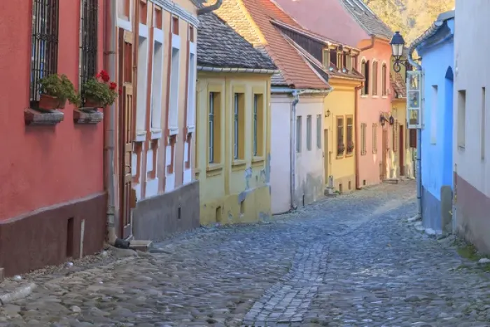 Framed Print : Europe, Romania, Sighisoara, cobblestone residential street of colorful houses in village Framed Print : Europe, Romania, Sighisoara, cobblestone residential street of colorful houses in village