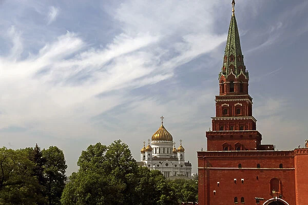 Europe, Russia, Moscow. Kremiln Tower with Cathedral of Christ the Savior in distance