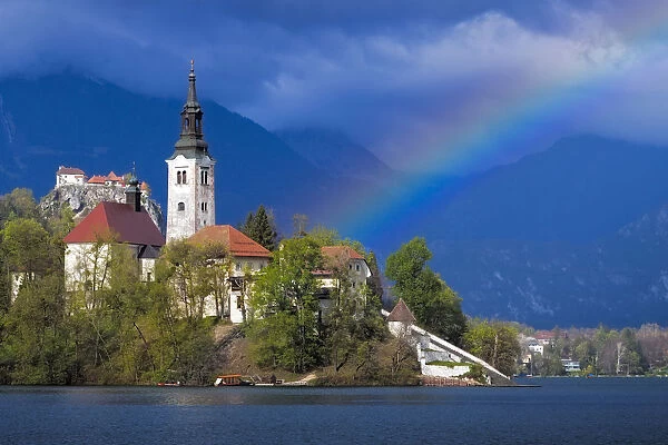 Europe, Slovenia, Lake Bled. Rainbow over lake and church