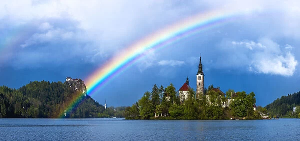 Europe, Slovenia. Rainbow over Lake Bled at sunset