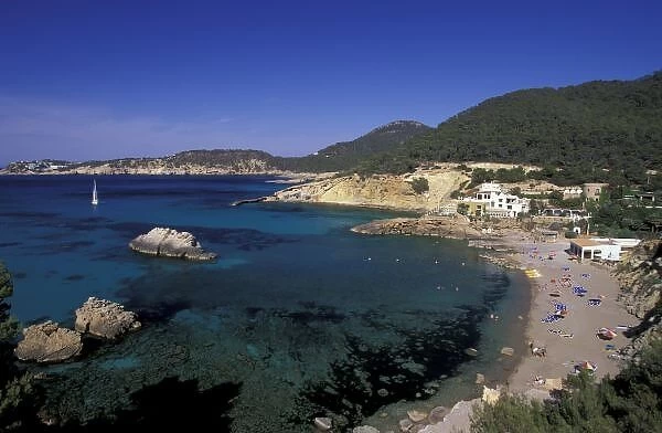 Europe, Spain, Balearics, Ibiza, Cala de Portinatx. Resort beach view