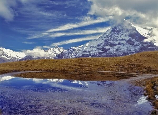 Europe, Switzerland, Eiger. The Eiger, a World Heritage Site, reflects in a small