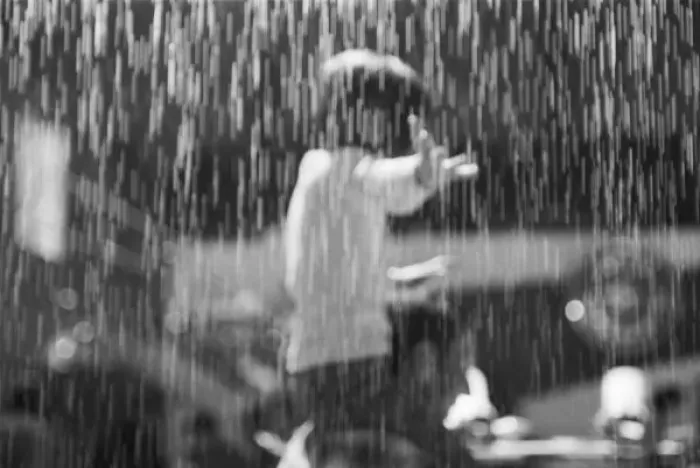 Framed Print : Europe, Switzerland, Geneva. Geneva Motor Show; girl and artificail rain at the Saab exhibit