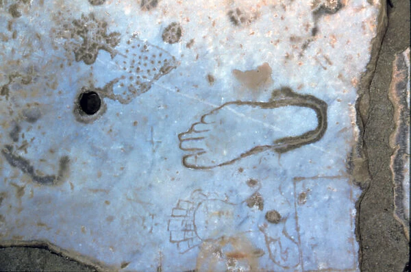 Europe, Turkey, Ephesus. Pictures of feet carved into marble Roman road point customers