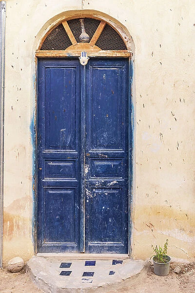 Faiyum, Egypt. A blue painted door on a building