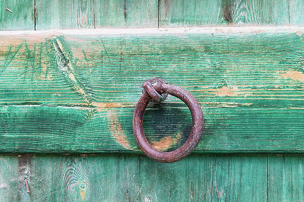 Faiyum, Egypt. Iron ring on a green painted wooden gate