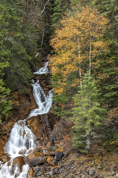 Fawn Creek Falls in autumn in the Flathead National Forest, Montana, USA
