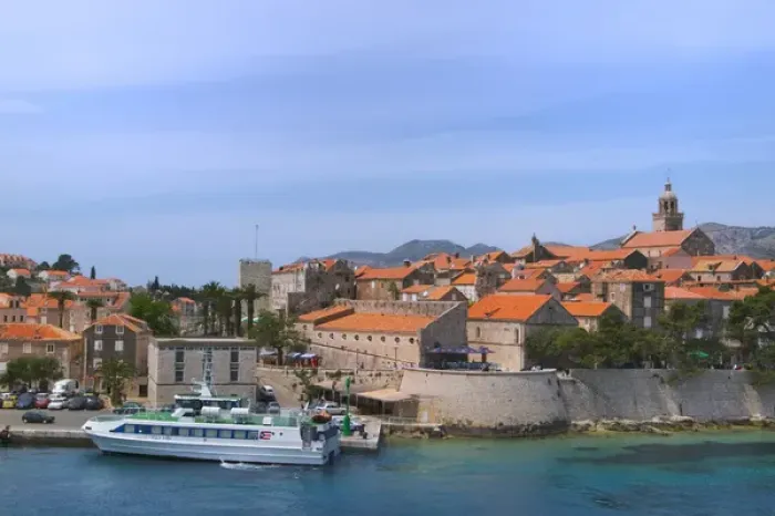 Framed Print : Ferry boat with cityscape of Korcula in Adriatic Sea, Croatia Framed Print : Ferry boat with cityscape of Korcula in Adriatic Sea, Croatia