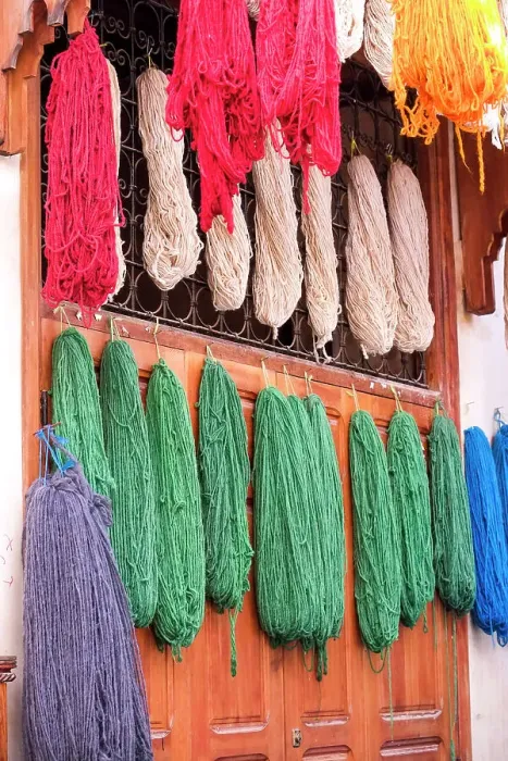 Framed Print : Fes, Morocco. Skeins of yarn hang to dry after being hand dyed