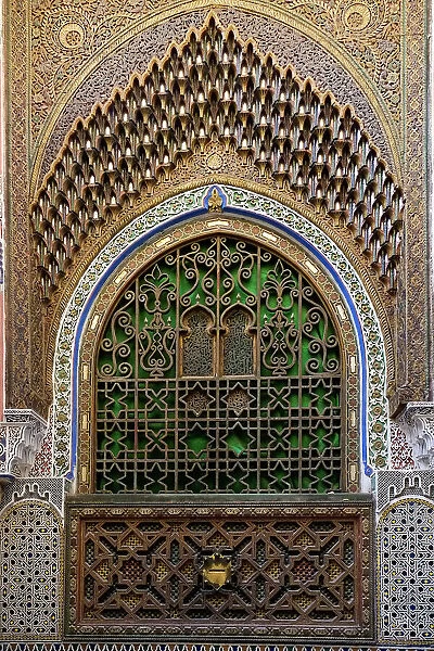 Fes, Morocco. Stunning exterior of a mosque wall with hand carved plaster, metal and wood work