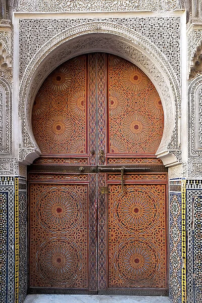 Fes, Morocco. Stunning hand painted door of an old mosque with hand carved plaster work