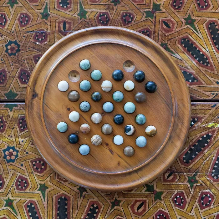 Framed Print : Fes, Morocco. Wooden game of marbles