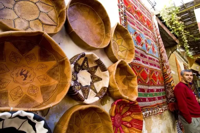 Framed Print : Fez Morocco leather baskets & Oriental carpet and proprietor in the old medina Framed Print : Fez Morocco leather baskets & Oriental carpet and proprietor in the old medina