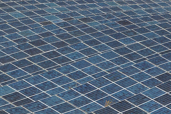A field filled with solar panels at a solar power plant. Les Mees, Provence, France