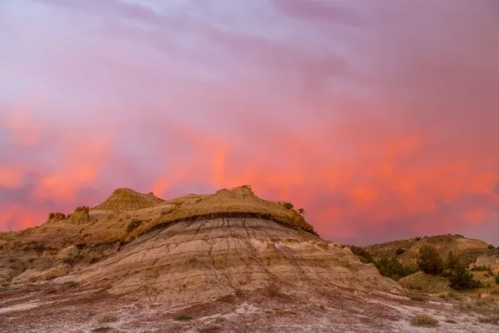 Framed Print : Fiery sunrise clouds over badlands at dawn in Theodore Roosevelt National Park, North Dakota Framed Print : Fiery sunrise clouds over badlands at dawn in Theodore Roosevelt National Park, North Dakota