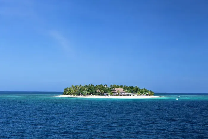 Framed Print : Fiji. Boats head towards Beachcomber Island, in the Mamanuca Island chain. This island is known as the party island of Fiji