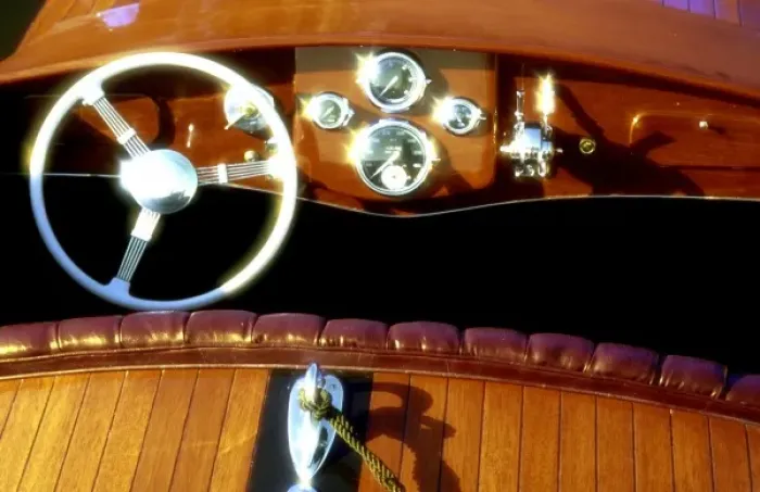 Framed Print : Finished woodwork on a wooden boat sparkles in the sun
