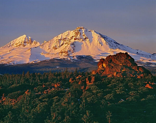 First light gives delicate color to the Middle and North Sister in the Oregon Cascades