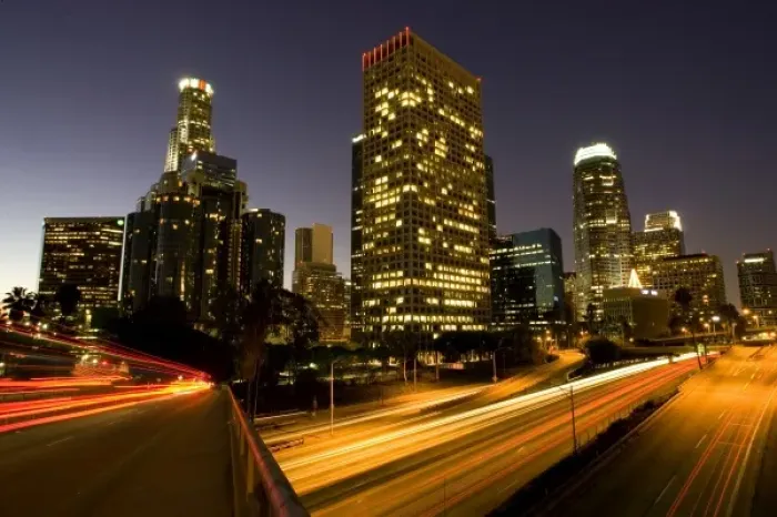 Framed Print : First light from sunrise illuminates downtown Los Angeles wih traffic streaking across Framed Print : First light from sunrise illuminates downtown Los Angeles wih traffic streaking across
