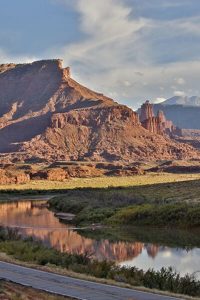 Fisher Towers reflected in Colorado River with Highway below, Utah in evening light