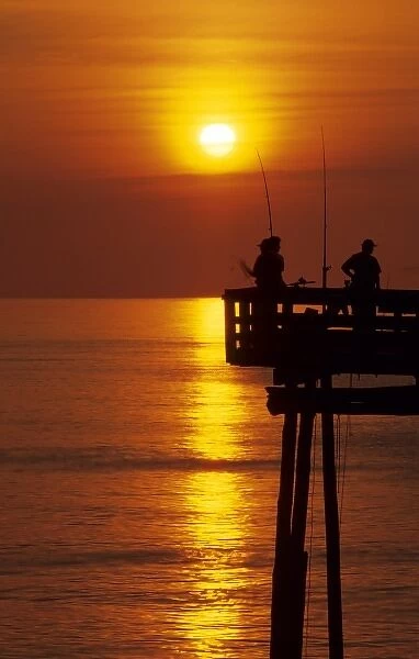 Fishermen on Nags Head pier Outer Banks, North Carolina, USA