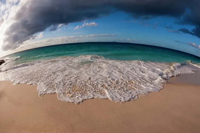 Framed Print : A fisheye lens view of Indian Ocean surf surging onto a sandy tropical beach. Anse Macquereau Beach, Fregate Island, Seychelles Framed Print : A fisheye lens view of Indian Ocean surf surging onto a sandy tropical beach. Anse Macquereau Beach, Fregate Island, Seychelles