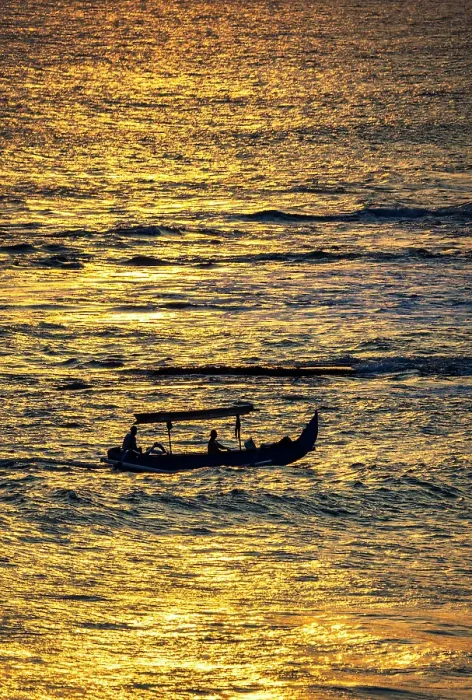 Framed Print : Fishing boat returning to shore in a blaze of gold sunset light in Bali, Indonesia Framed Print : Fishing boat returning to shore in a blaze of gold sunset light in Bali, Indonesia