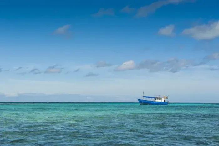 Framed Print : Fishing boat in the turquoise waters of the blue lagoon, Yasawas, Fiji, South Pacific