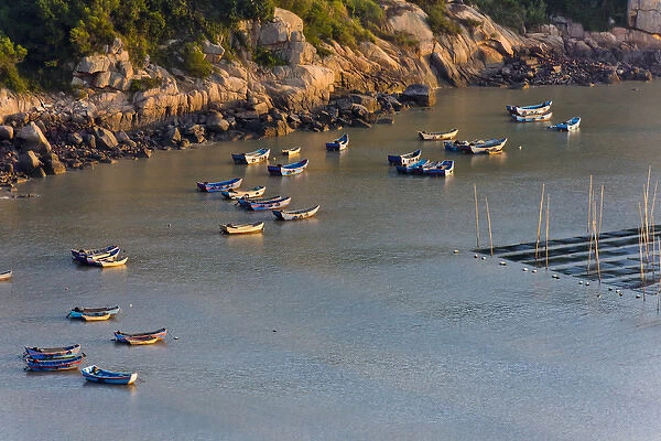 Fishing boats on the muddy beach at sunrise, East China Sea, Xiapu, Fujian, China