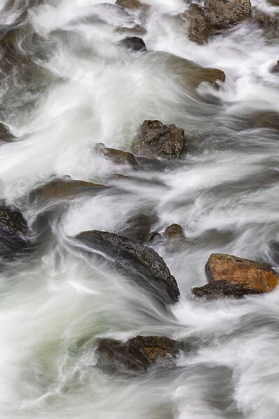 Flowing water in Firehole River, Yellowstone National Park, Wyoming